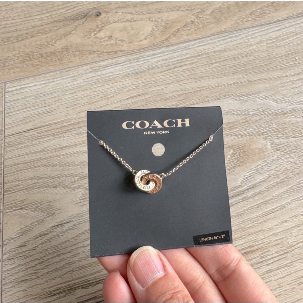 Coach Gold-Tone Interlocking Signature Pendant Necklace
